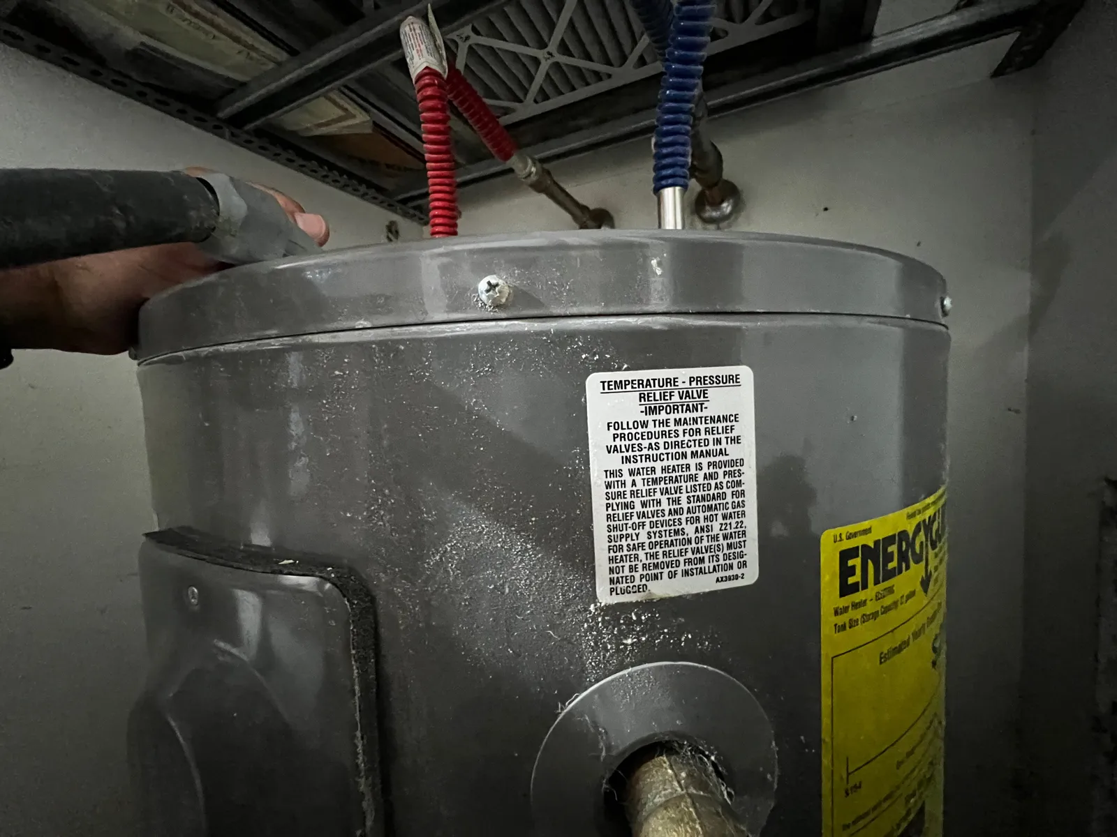 Water heater relief valve photographed for a 4-point inspection