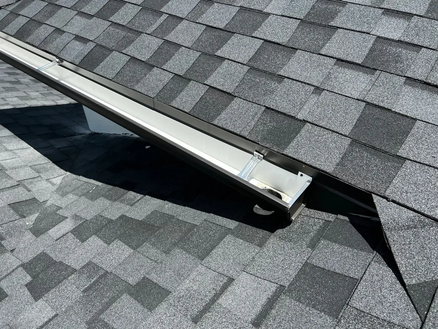 Shingle roof and ridge checked during a wind mitigation inspection